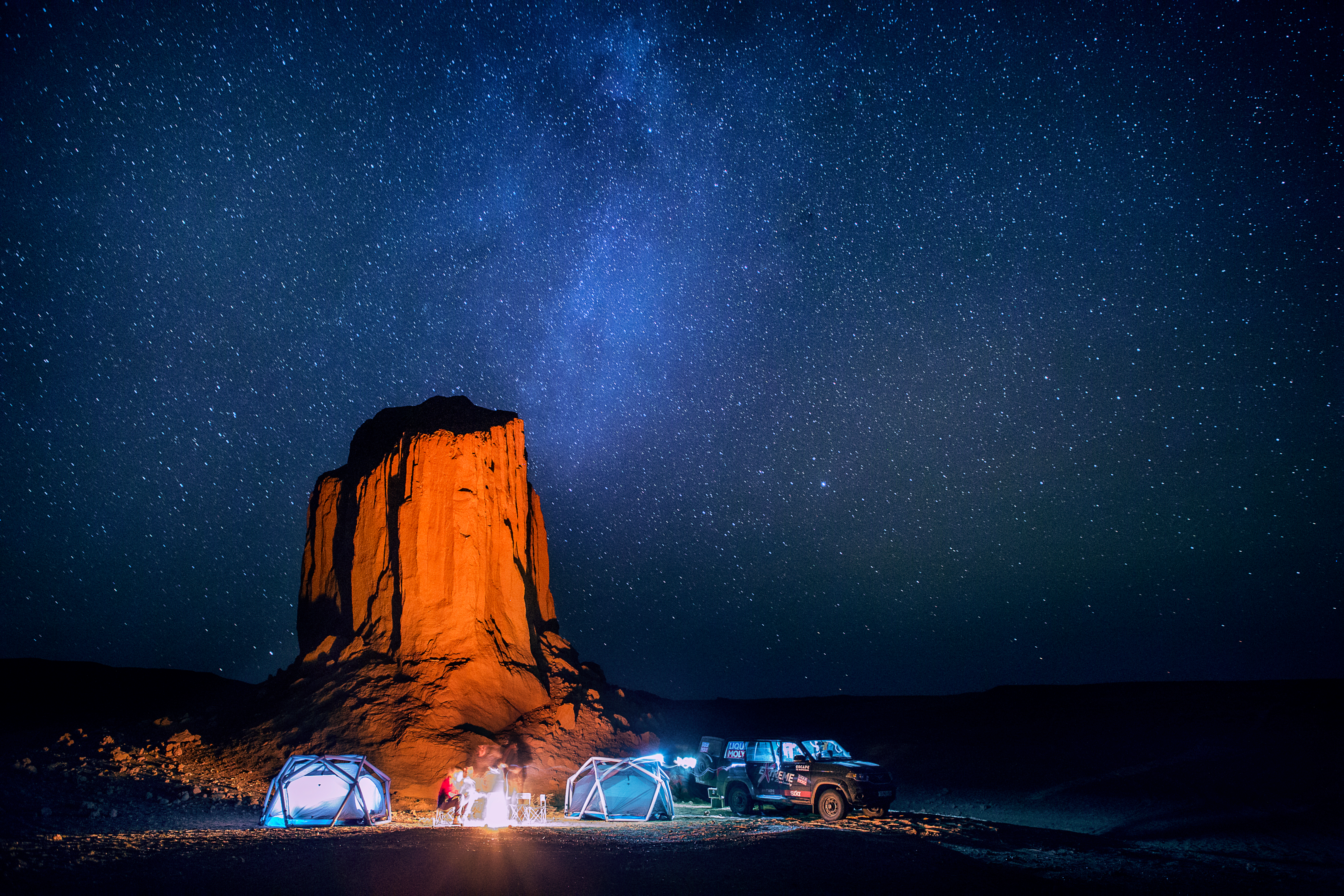 A picture of a person standing in the Gobi Desert, looking out over the vast landscape