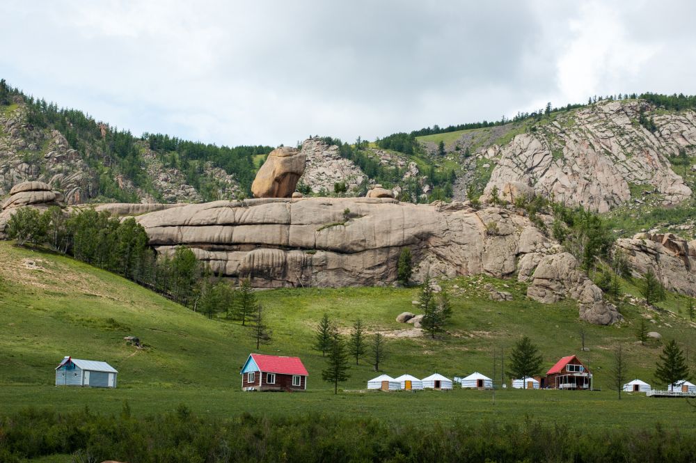 Ger camps surrounded by mountains and grassland in terelj National park Mongolia