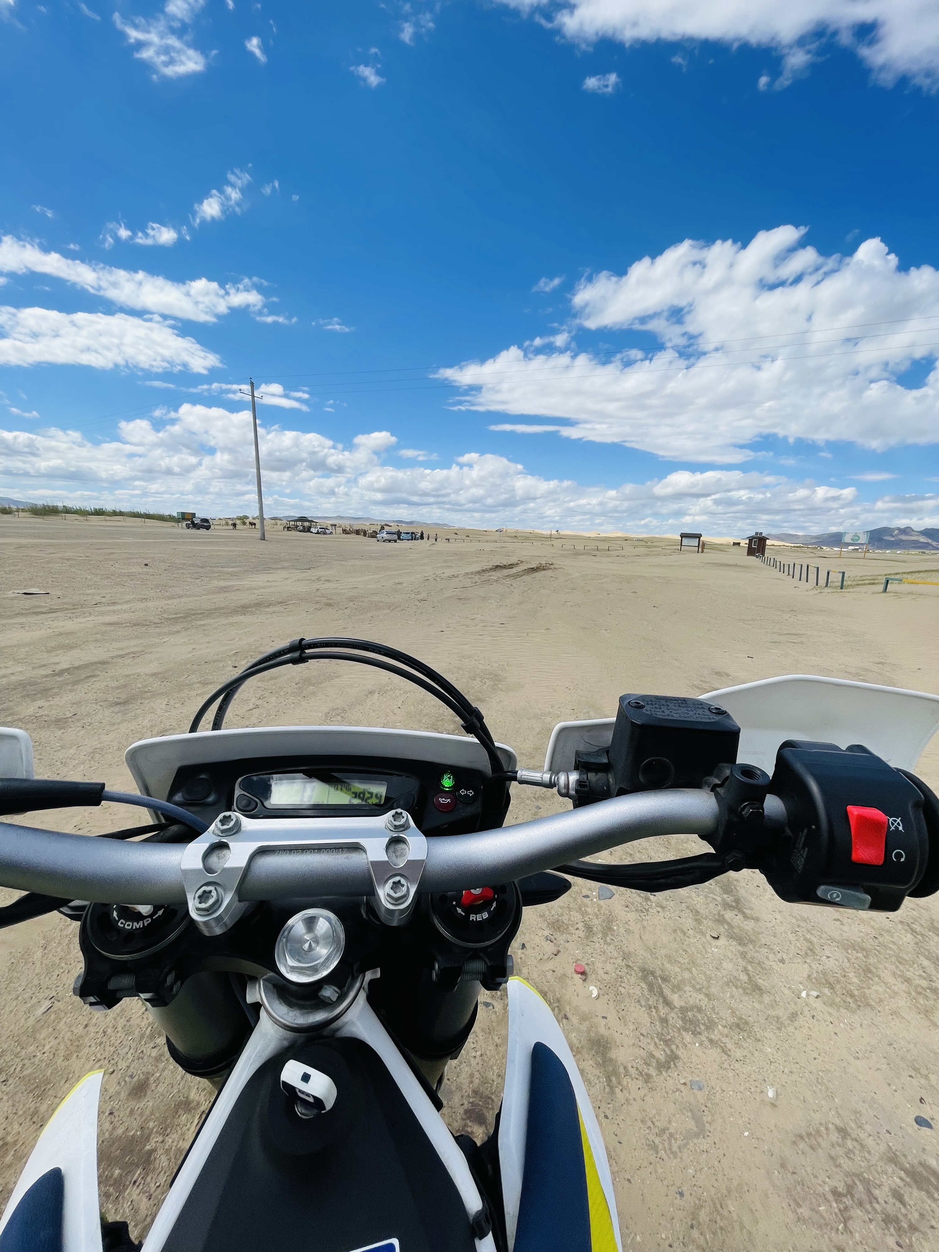 Motorcycle riding through the endless steppes of Mongolia