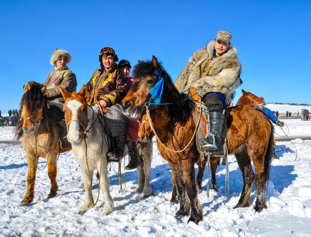 Men riding horses in Northern Mongolia